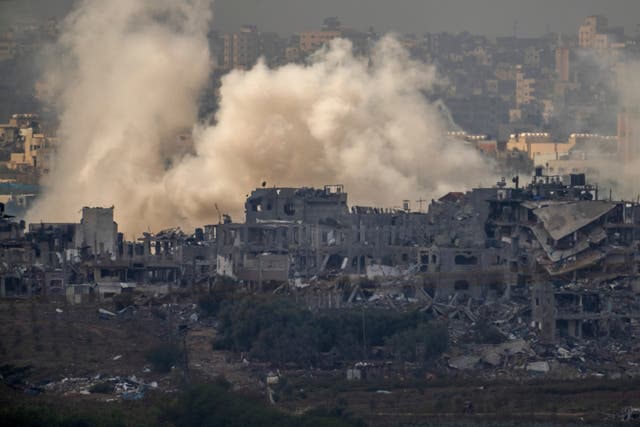 Smoke rises from an explosion in the Gaza Strip as seen from southern Israel