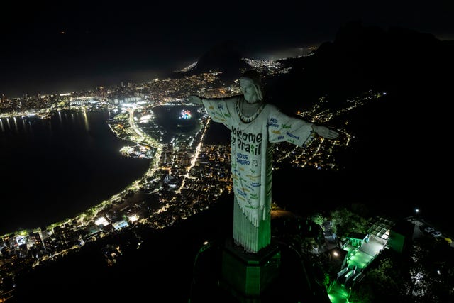The Christ the Redeemer statue is illuminated with a welcome message for American singer Taylor Swift, in Rio de Janeiro, Brazil
