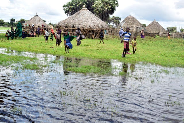 Residents in the flooded village of Lumshi in Mpeketoni within Lamu County, Kenya