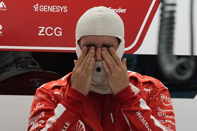 Ferrari driver Charles Leclerc rubs his eyes before the start of the second practice session