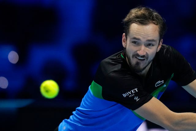 Daniil Medvedev stretches for a backhand