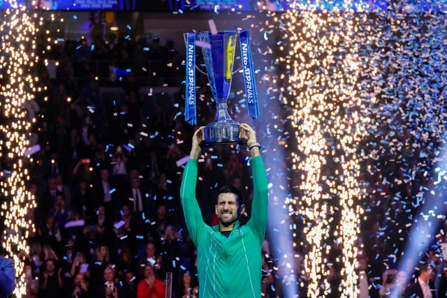 Novak Djokovic holds aloft the ATP Finals trophy on Sunday 