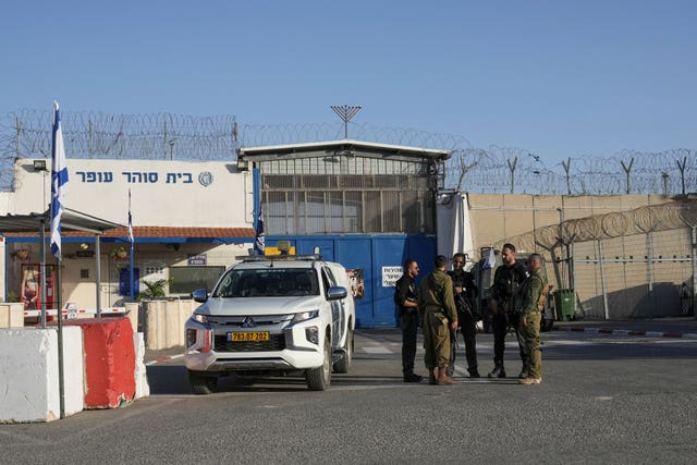 Israeli soldiers stand outside Ofer military prison near Jerusalem 