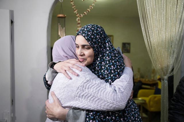 Marah Bakir, right, a former Palestinian prisoner who was released by the Israeli authorities, is welcomed at her family home