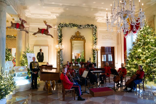 Holiday decorations adorn the Grand Foyer of the White House for the 2023 theme Magic, Wonder, and Joy