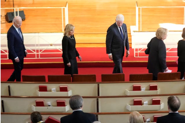 President Joe Biden, left, first lady Jill Biden, for President Bill Clinton and former first lady Hillary Clinton, right, arrive to attend a tribute service for former first lady Rosalynn Carter at Glenn Memorial Church in Atlanta