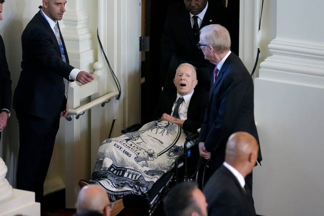 Former president Jimmy Carter arrives to attend a tribute service for his wife and former first lady Rosalynn Carter at Glenn Memorial Church in Atlanta 
