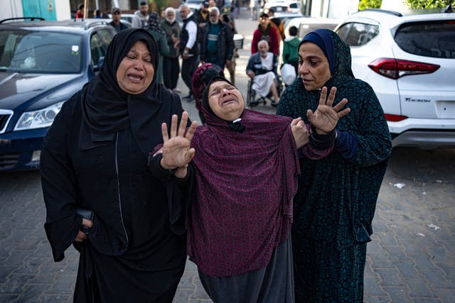 Palestinians mourn their relatives killed in the Israeli bombardment of the Gaza Strip, in the hospital in Khan Younis