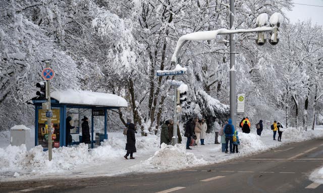 Snowfall on a bus shelter