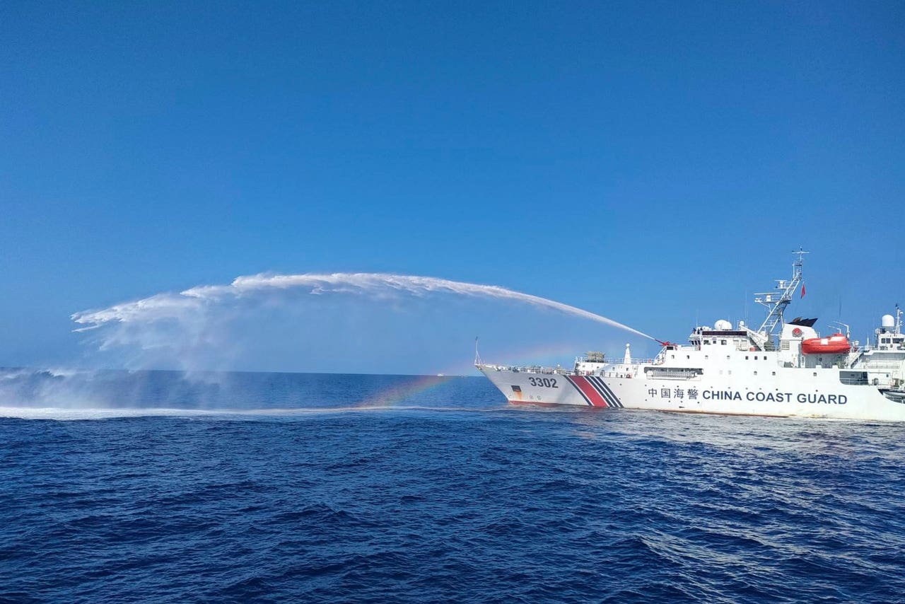 Chinese coast guard ships blast Philippine vessels with water cannon
