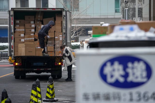 A worker unloading food products