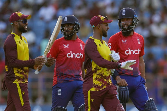 Moeen Ali (right) in action for England