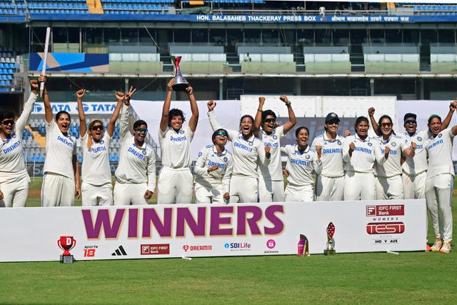 India Women celebrate their first Test win against Australia Women on Sunday in their one-off match in Mumbai
