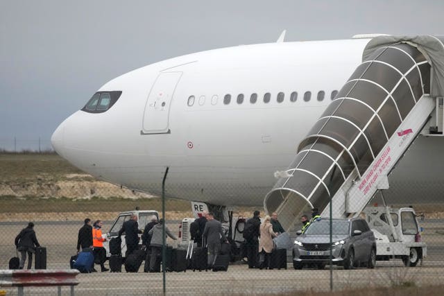 Crew members board the plane grounded by police at the Vatry airport in Vatry, eastern France 