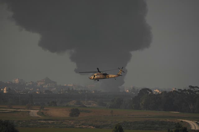 An Israeli military helicopter flies near the Israeli-Gaza border on Monday
