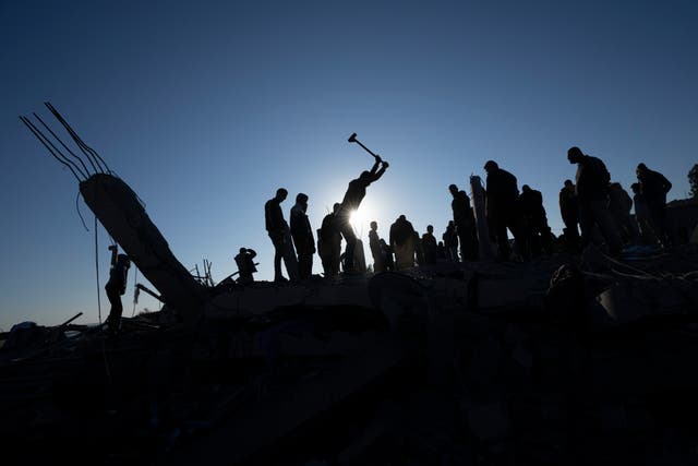 Palestinians dig for bodies in rubble