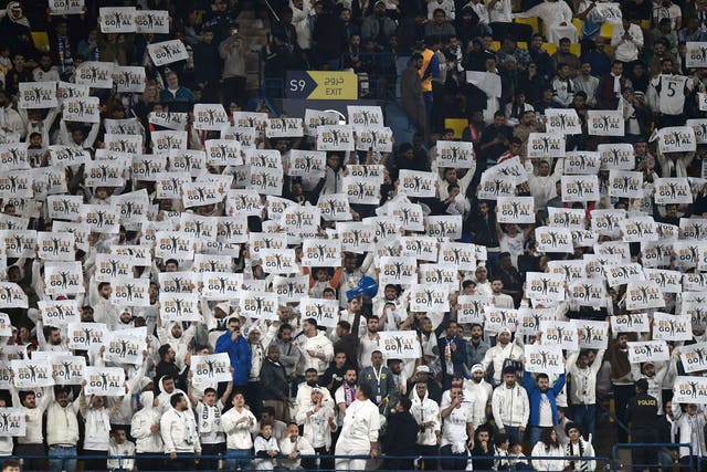 Real Madrid fans raise goal signs