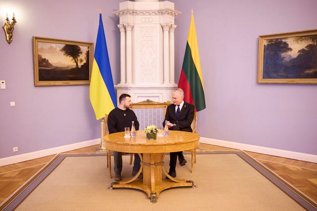 Lithuania’s President Gitanas Nauseda, right, talks with Ukrainian President Volodymyr Zelensky during their meeting in Vilnius, Lithuania, on Wednesday