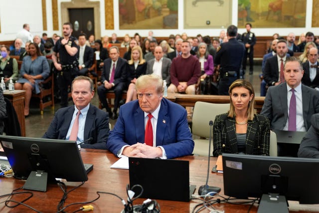 Former US president Donald Trump, centre, sits in the courtroom before the start of closing arguments in his civil business fraud trial at New York Supreme Court 