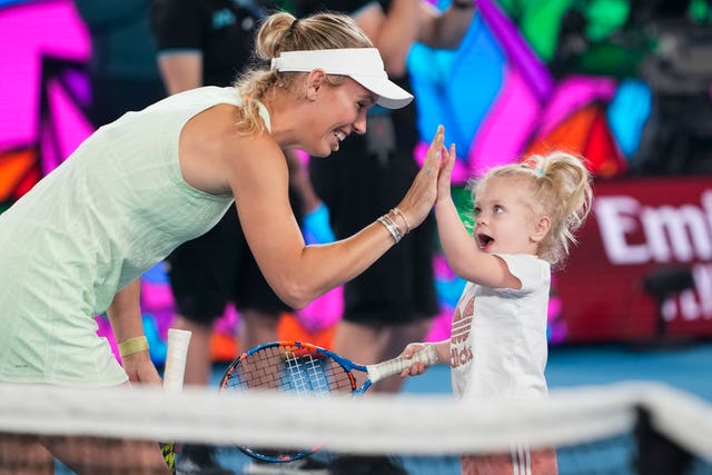 Caroline Wozniacki with daughter Olivia at Melbourne Park 