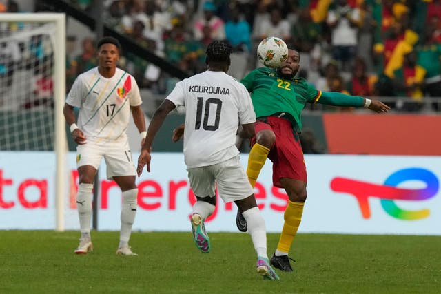 Cameroon’s Olivier Ntcham (right) in action against Guinea