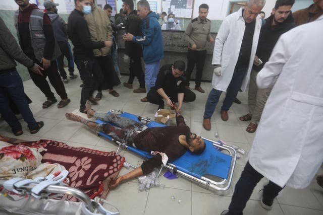 A Palestinian wounded in the Israeli bombardment of the Gaza Strip is treated in hospital in Rafah on Tuesday