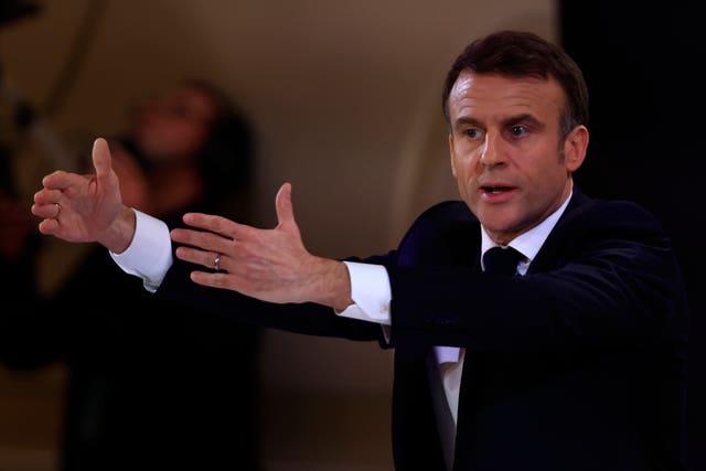 French President Emmanuel Macron gestures during the press conference