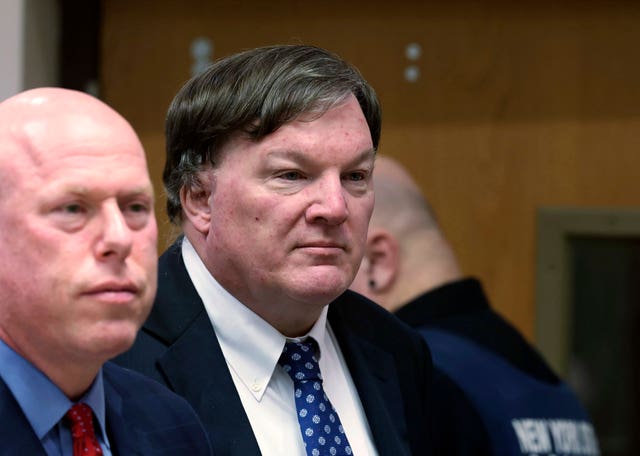 Rex Heuerman, right, listens in court on Tuesday