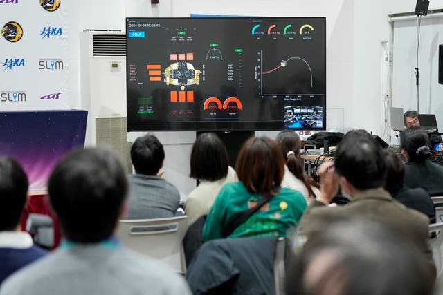 Journalists watch a livestream of the pinpoint Moon landing operation by the Smart Lander for Investigating Moon spacecraft at JAXA’s Sagamihara Campus in Sagamihara near Tokyo