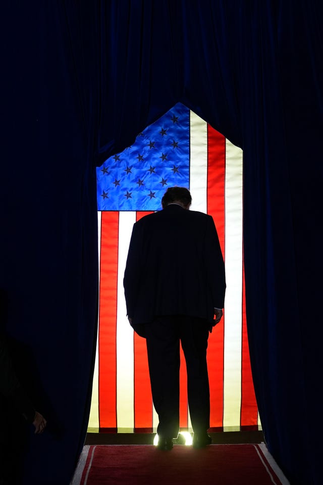 Mr Trump walking off stage after speaking at a campaign event in Manchester, New Hampshire, on Saturday