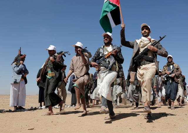 Houthi fighters march during a rally of support for Palestinians in the Gaza Strip