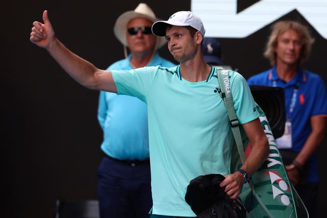 Hubert Hurkacz gives a thumbs up as he leaves Rod Laver Arena 