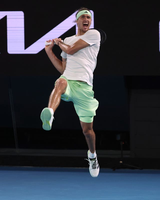Alexander Zverev leaps in the air as Carlos Alcaraz's final shot goes out