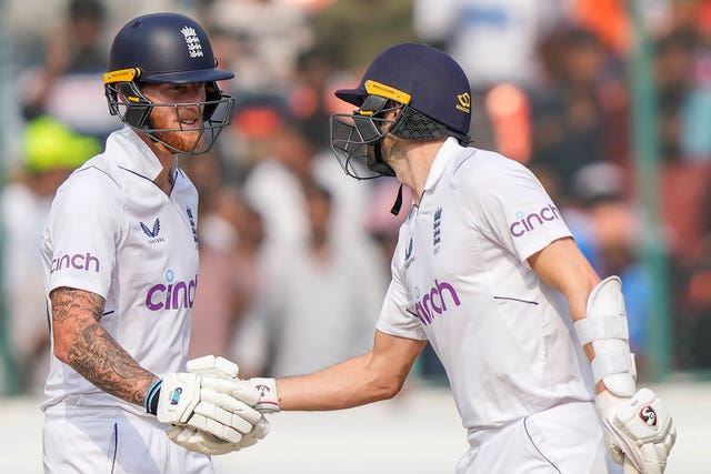Stokes, left, celebrates his fifty with Wood