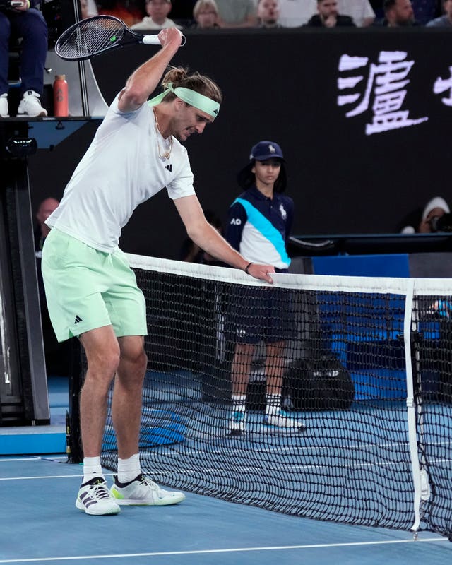 Alexander Zverev smacks the net with his racket