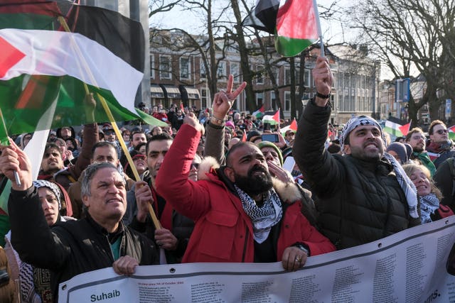 Pro-Palestinian activists react near the International Court of Justice in The Hague, Netherlands