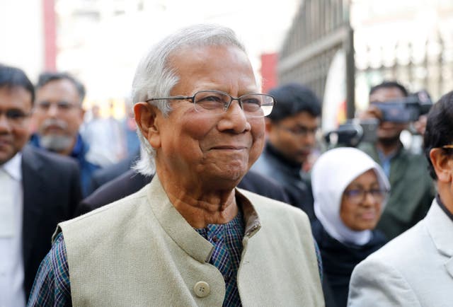 Nobel Peace Prize laureate Muhammad Yunus smiles as he arrives to appear before a labour court in January 