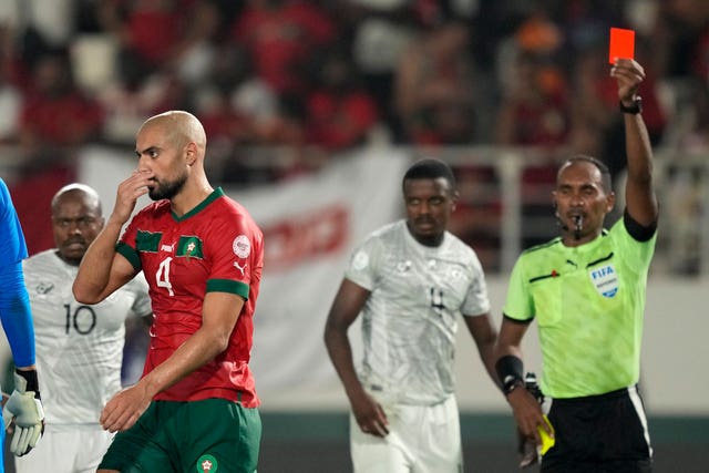 Morocco’s Sofyan Amrabat walks off the pitch after receiving a red card