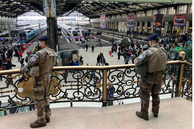 Soldiers patrol inside the Gare de Lyon station 