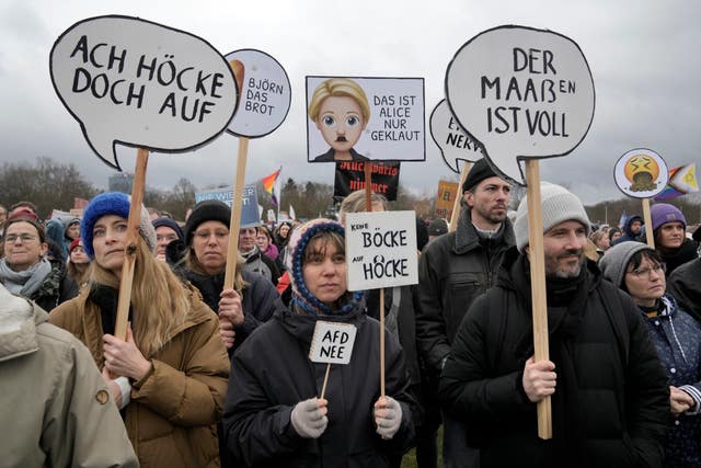 People protest in front of Germany’s parliament Reichstag at a demonstration against the AfD party and right-wing extremism in Berlin, Germany