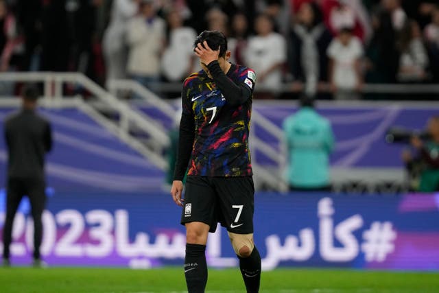 Son Heung-min cut a dejected figure after South Korea's Asian Cup exit (Thanassis Stavrakis/AP)