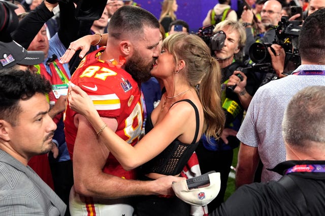 Taylor Swift kisses Kansas City Chiefs tight end Travis Kelce after the NFL Super Bowl