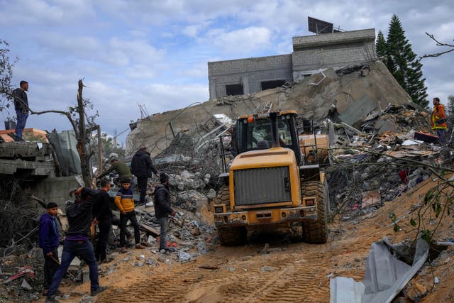 Palestinians search rubble