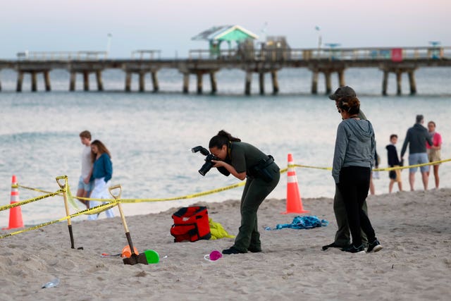 Investigators on the Florida beach