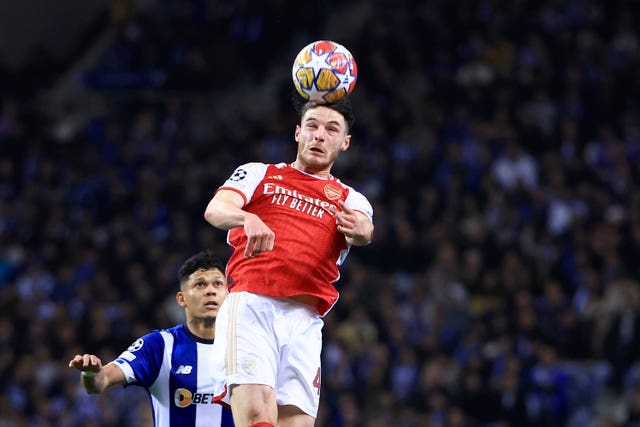 Arsenal’s Declan Rice heads the ball next to Porto’s Evanilson
