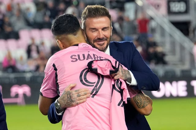 Inter Miami co-owner David Beckham hugs new signing Luis Suarez