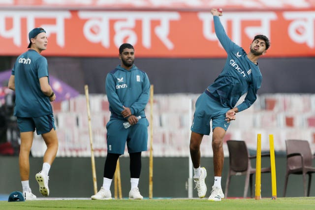 Rehan Ahmed, centre, has taken 11 wickets in three Tests in India (Surjeet Yadav/AP)