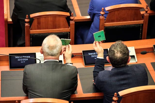 Members of the ruling Socialist party vote on the proposal