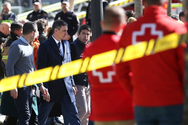 Spanish Prime Minister Pedro Sanchez arrives at the site of the 14-storey building burned down in Valencia, Spain
