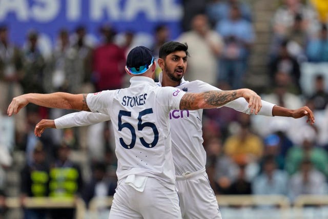 Shoaib Bashir, right, and Ben Stokes celebrate the wicket of Rajat Patidar